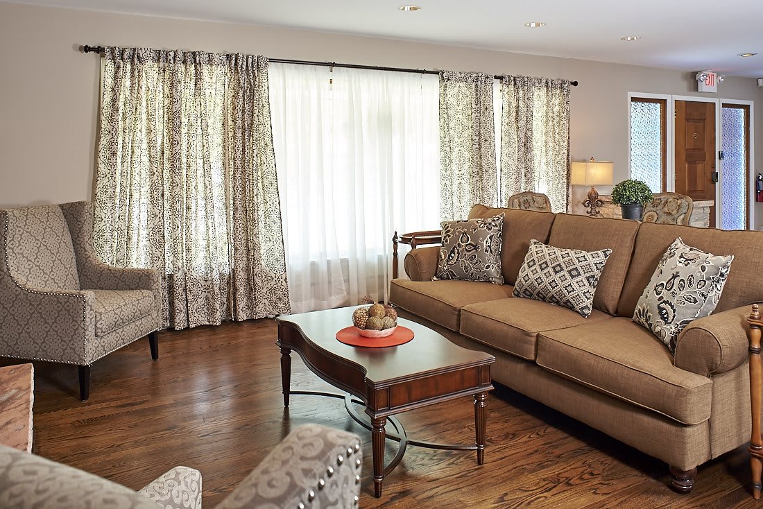 A cozy living room with a comfortable sofa and wooden coffee table.