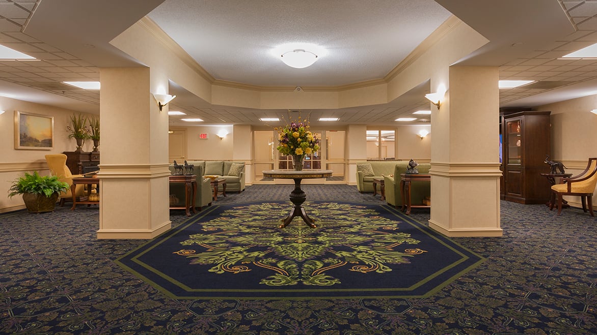A spacious hotel lobby with elegant decor and comfortable seating arrangements.