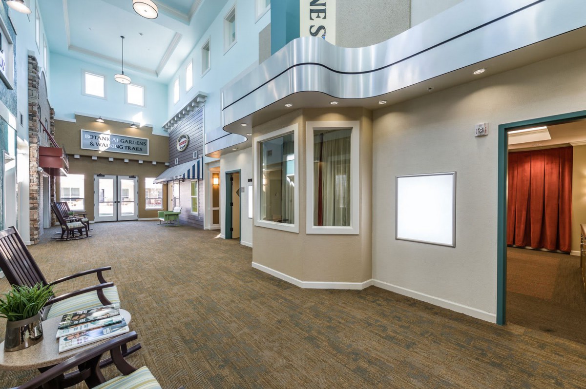 A modern lobby with large windows and stylish architecture.