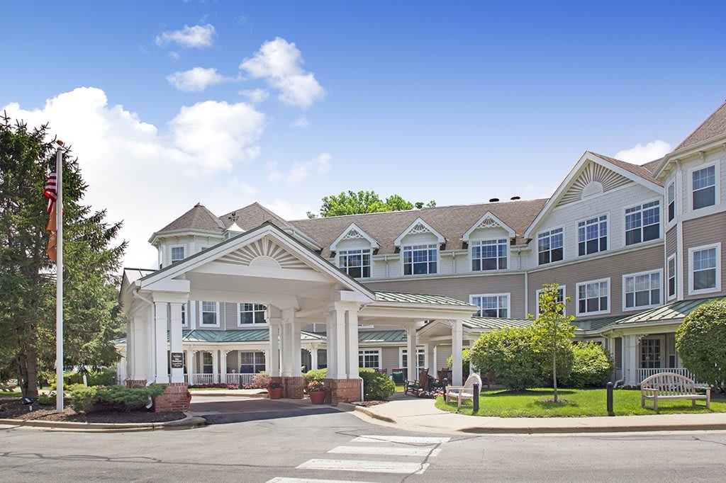 A large residential building with a welcoming entrance and well-maintained landscaping.