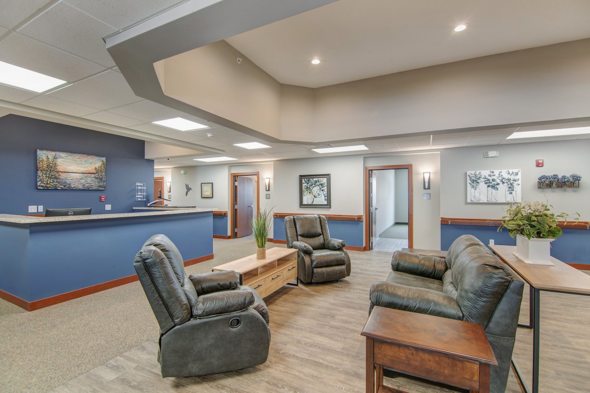 A cozy waiting room featuring comfortable seating and a welcoming atmosphere.