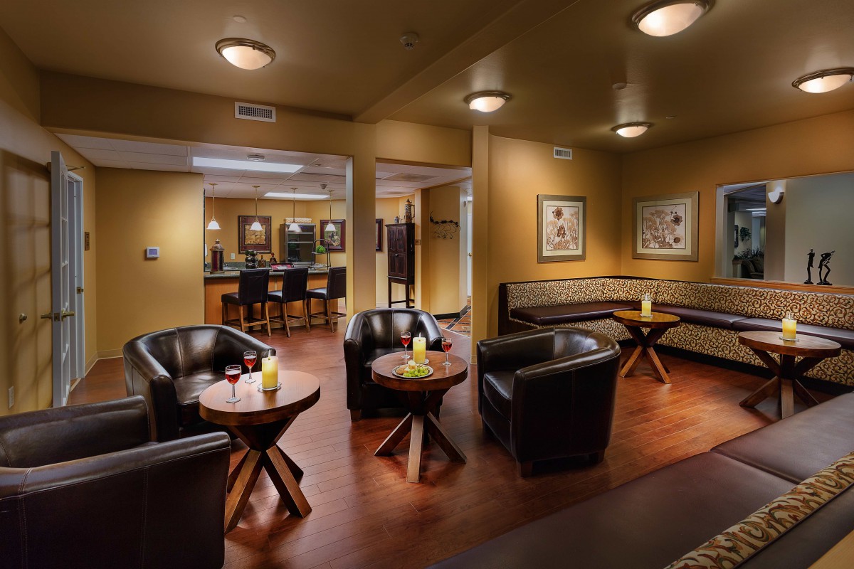 A cozy lounge area with modern seating and soft lighting.