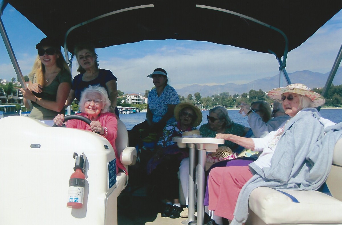 A group of seniors enjoying a leisurely boat ride on a sunny day.