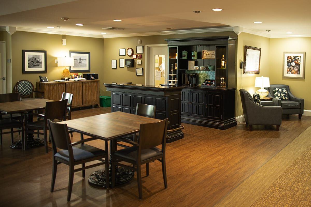 A cozy dining area with wooden furniture and warm lighting.