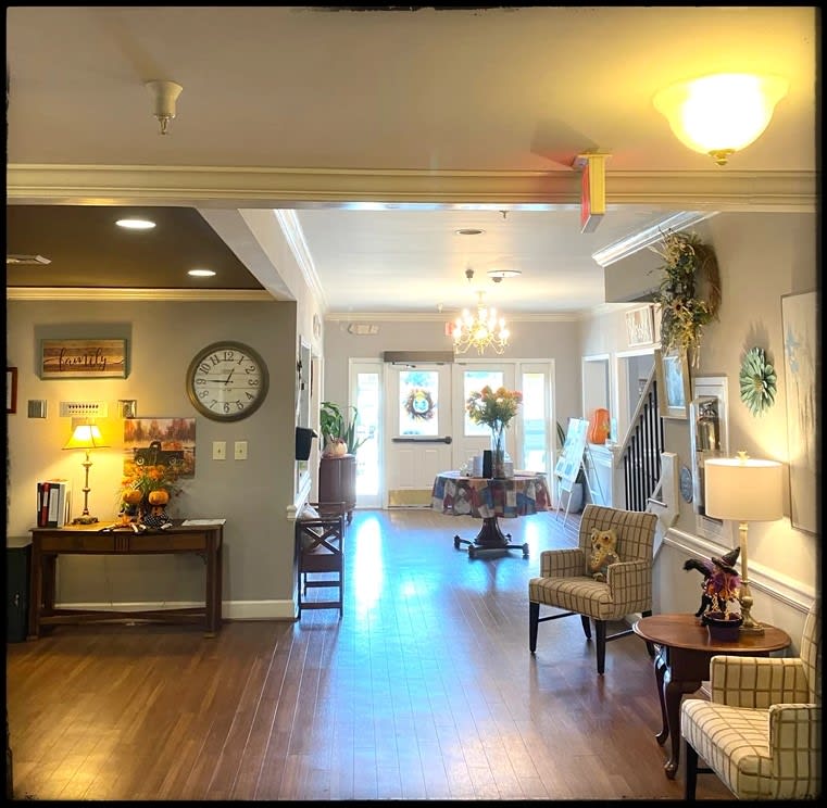 A cozy living space with comfortable seating and warm lighting.