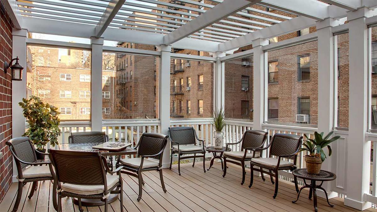 A stylish rooftop patio with comfortable seating and city views.