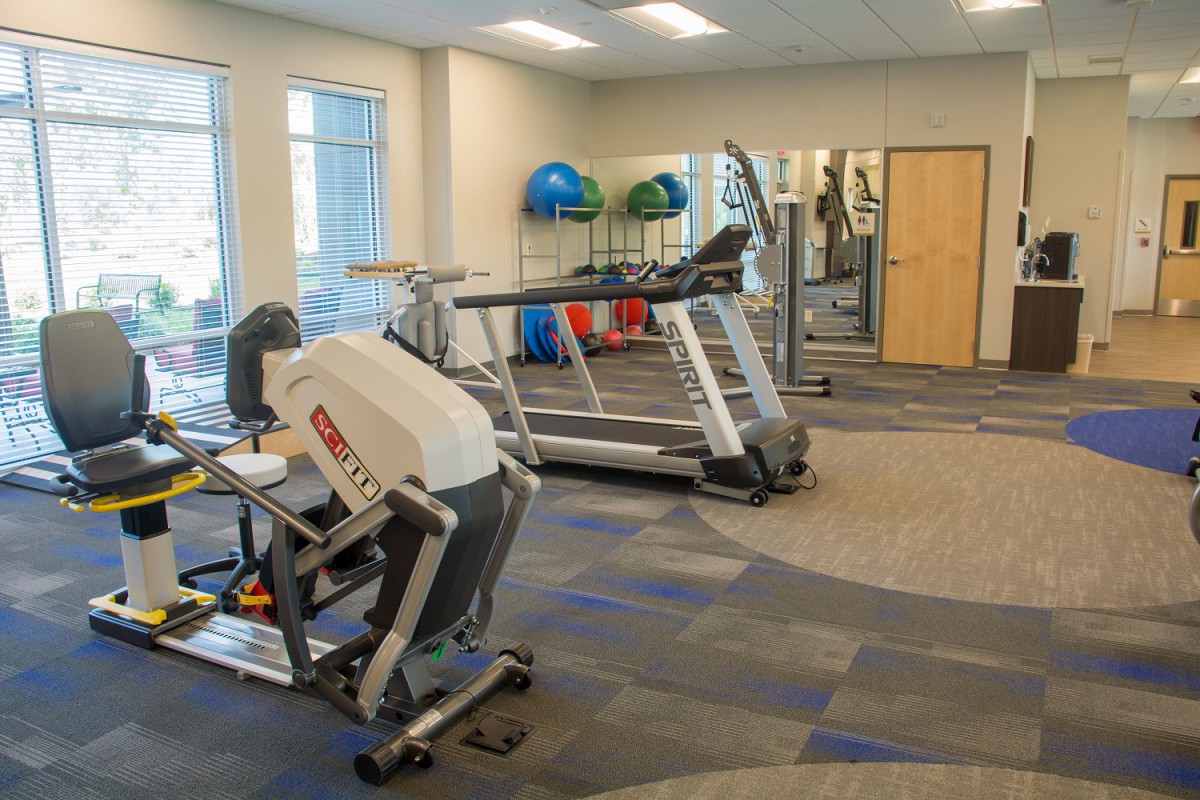 A well-equipped gym with exercise machines and fitness accessories.