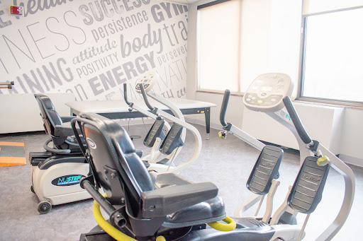 A well-equipped gym featuring various exercise machines for a great workout experience.