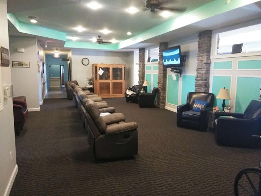 A spacious and modern waiting room with comfortable seating and a welcoming atmosphere.