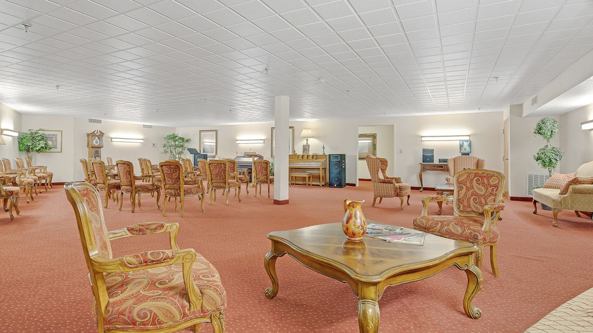 A spacious lounge area with elegant furniture and soft lighting.