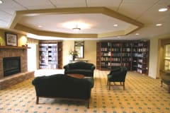 A cozy library interior with comfortable seating and bookshelves.