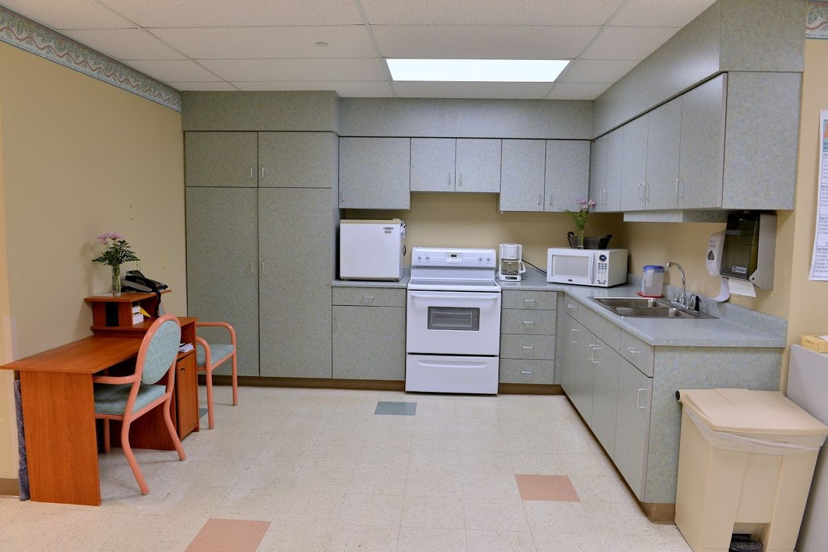 A kitchen with modern appliances and cabinetry.