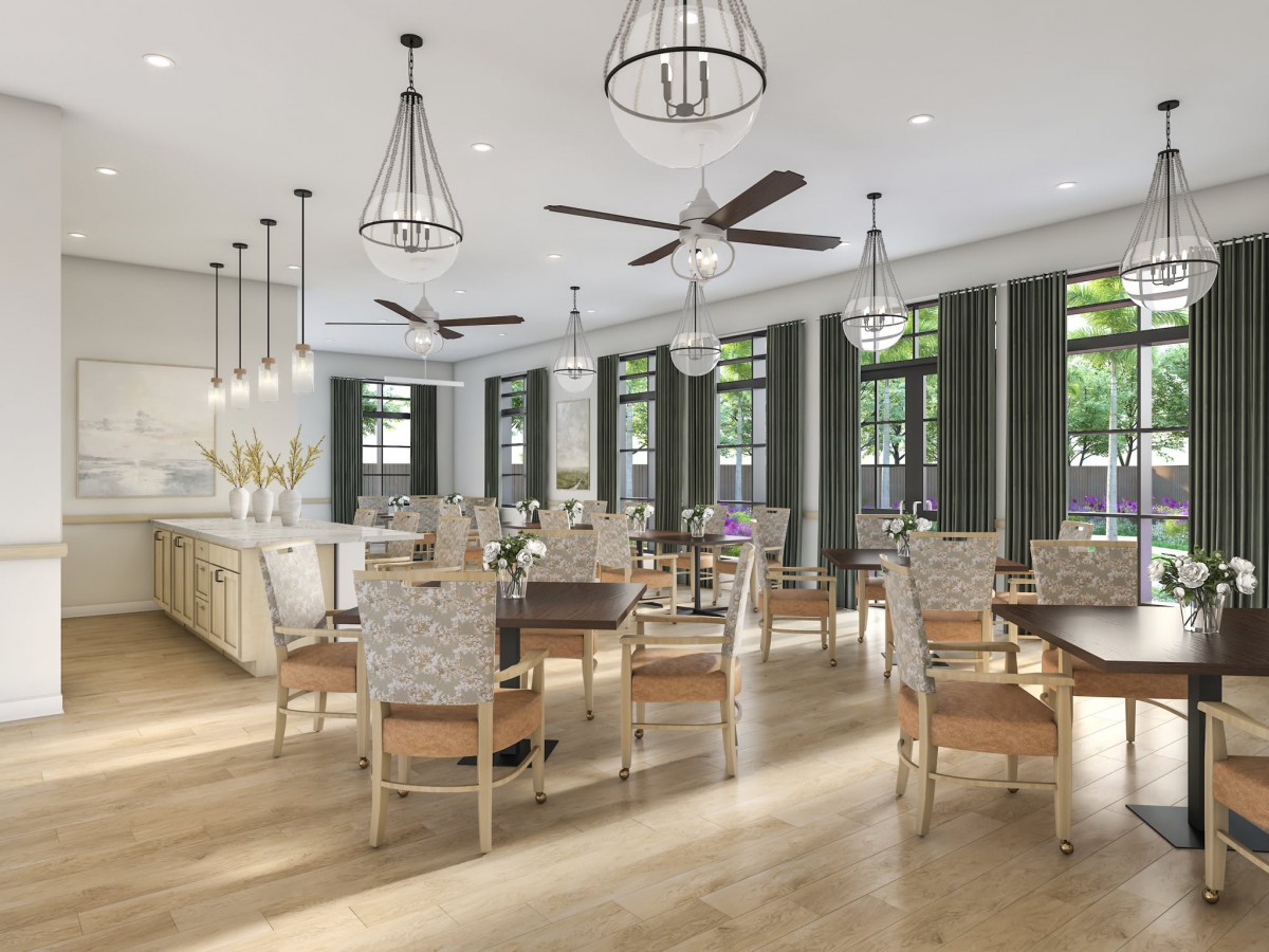 A spacious and elegantly designed dining area with modern chandeliers, ceiling fans, and abundant natural light.