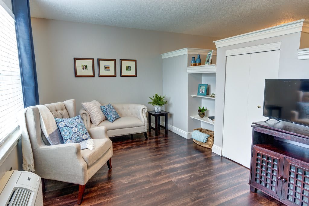 A cozy living room with elegant furniture and tasteful decor.