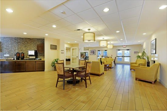 A spacious and modern lounge area with comfortable seating and ambient lighting.