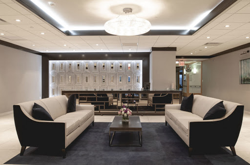 A modern hotel lobby featuring elegant seating and stylish lighting.