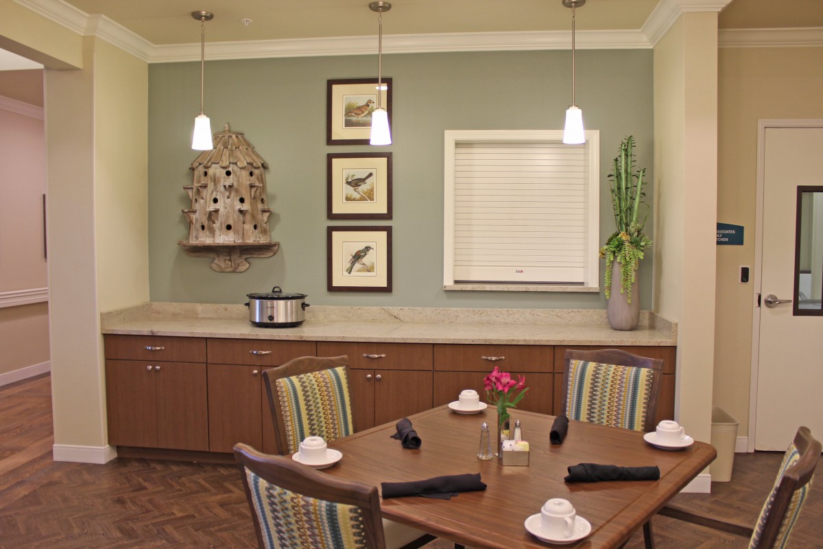 A cozy dining room with a neatly set table and stylish decor.