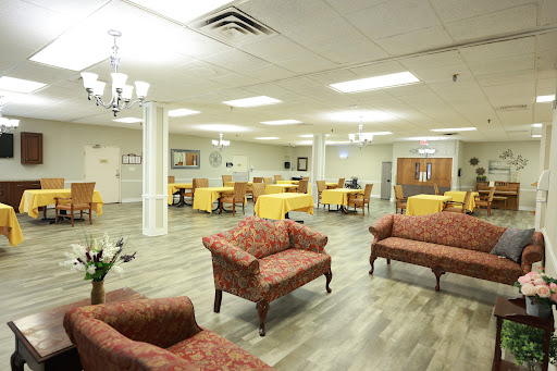 A spacious lounge area featuring comfortable seating and dining spaces, ideal for social gatherings.