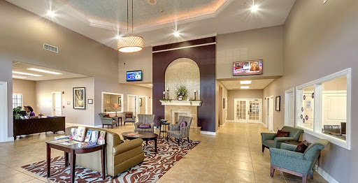 A modern and inviting lobby space featuring stylish furniture and warm lighting.