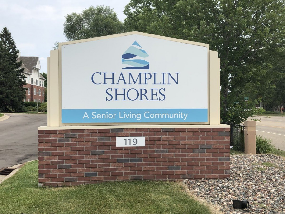 Sign for Champlin Shores, a senior living community.