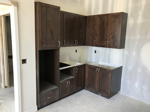 A set of unfinished kitchen cabinets in a contemporary design.