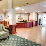 A welcoming lobby with a reception desk and comfortable seating.