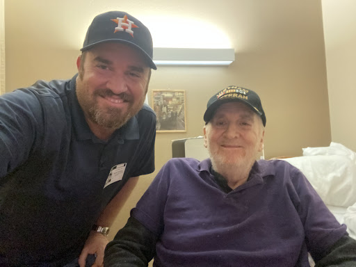 A joyful moment captured between friends at a care facility.