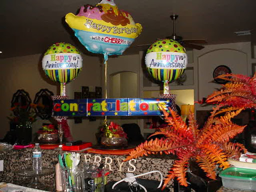 A festive setup with colorful balloons and decorations for a celebration.