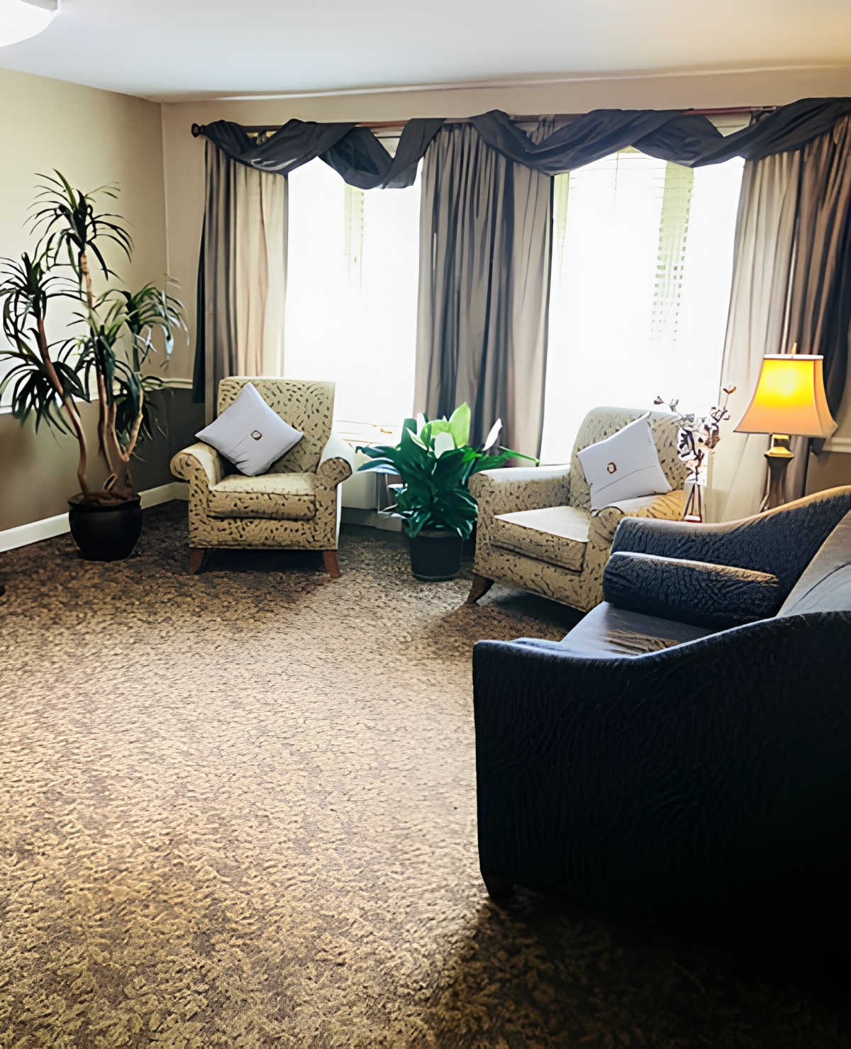 Cozy living room with comfortable seating and ambient lighting.