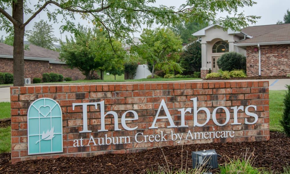 Entrance sign for 'The Arbors at Auburn Creek' neighborhood.