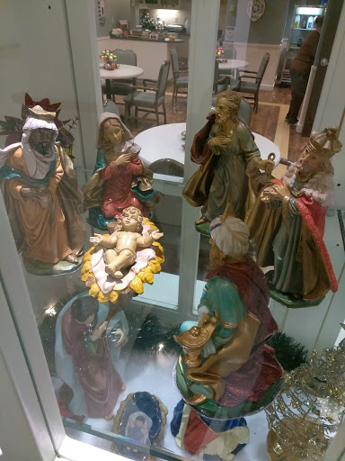 A beautifully crafted nativity scene featuring various figurines representing the birth of Jesus.
