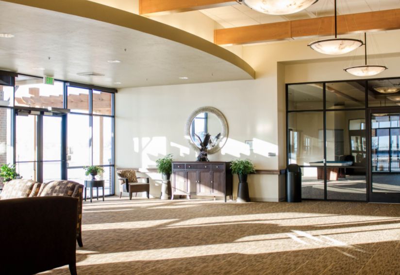 A spacious lobby area with modern decor and abundant natural light.