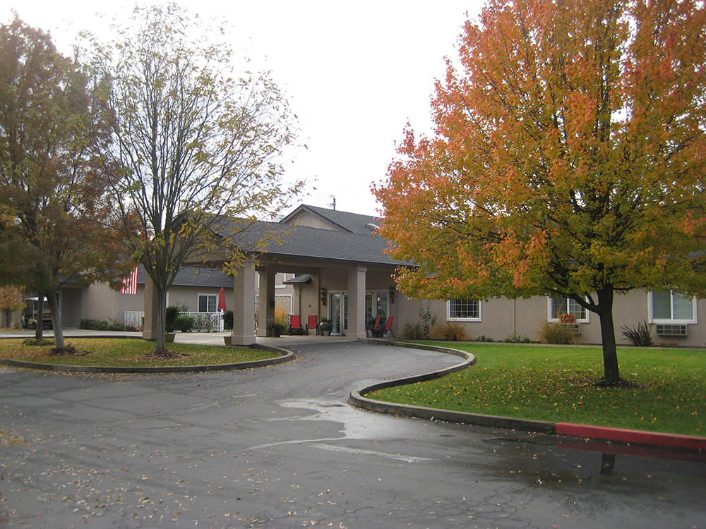 Entrance to a building surrounded by autumn foliage.