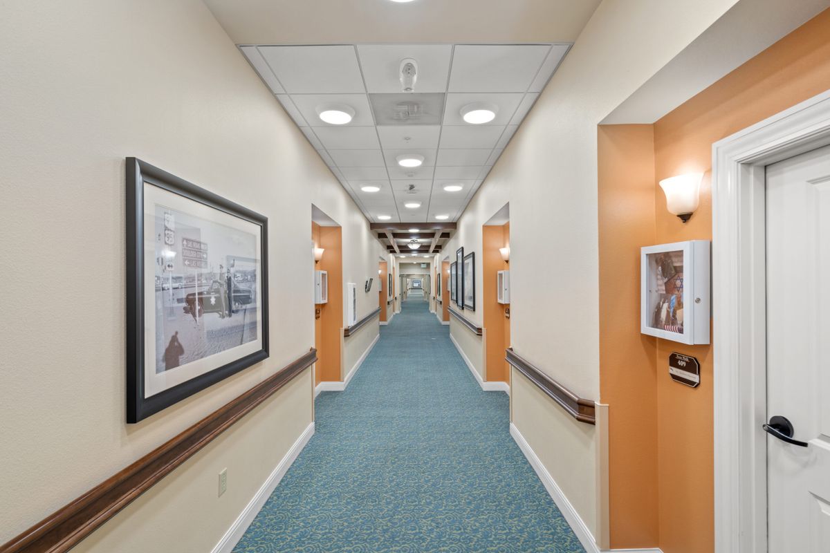 A clean and well-lit hospital corridor with modern design elements.