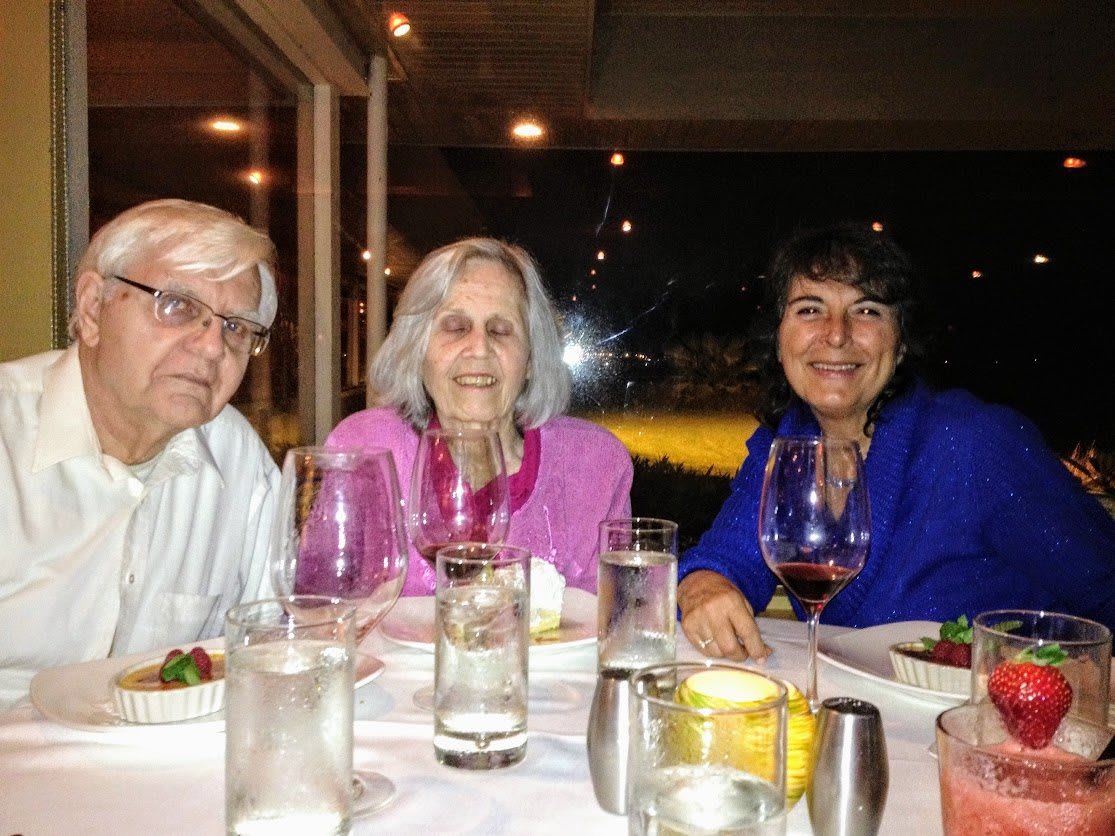 A group of people enjoying a meal together at a restaurant.