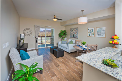 A modern living room featuring stylish furniture, natural light, and a welcoming atmosphere.