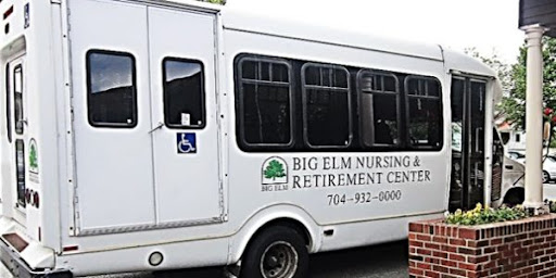 A transportation bus for Big Elm Nursing and Retirement Center, featuring accessibility options.
