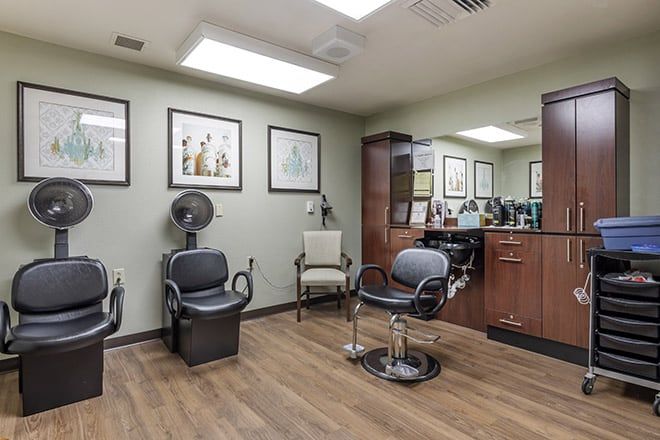 A modern hair salon interior with styling chairs and mirrors.