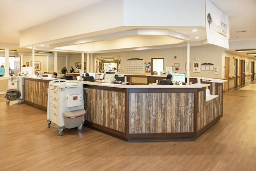 A modern healthcare reception area with wooden accents and a welcoming environment.