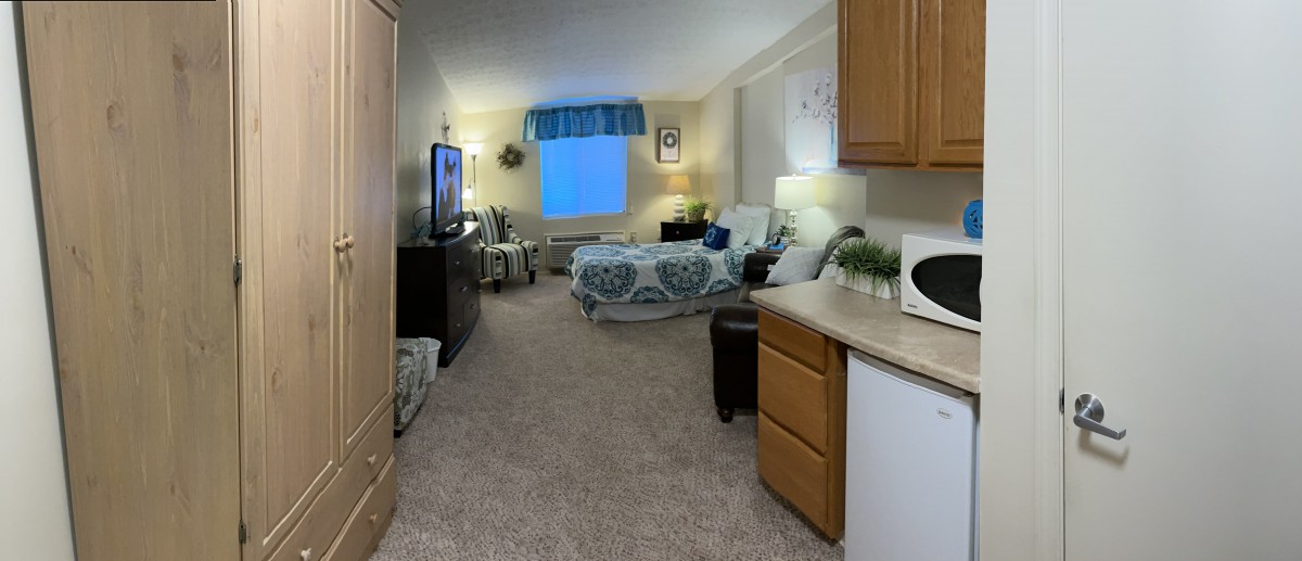 A cozy and well-decorated bedroom with a comfortable bed, stylish furnishings, and soft lighting.