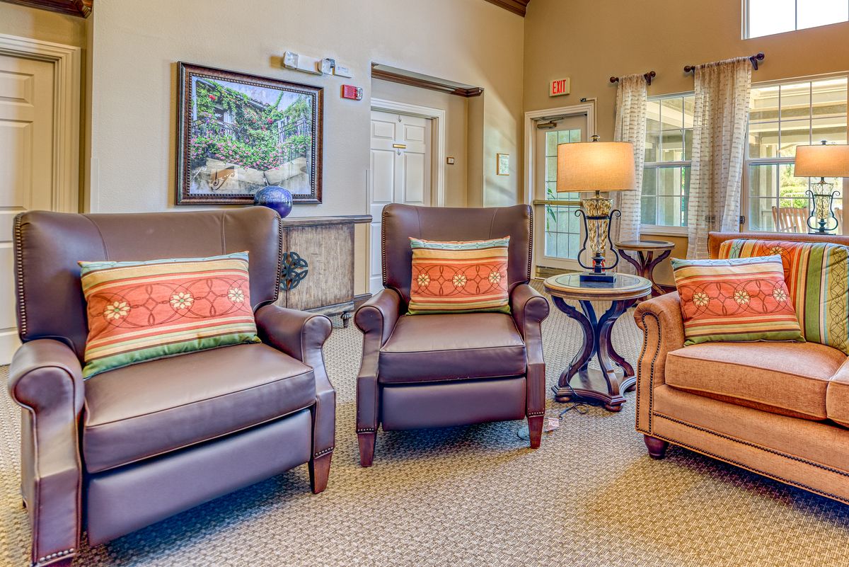A cozy living room with comfortable chairs and warm lighting.