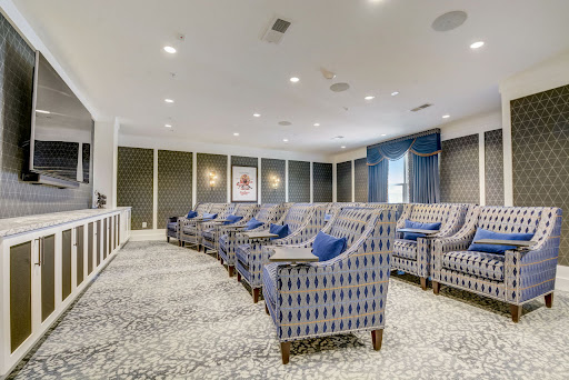 A stylish and comfortable home theater featuring plush seating and elegant decor.