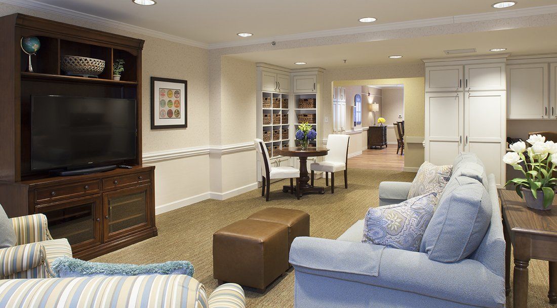 A cozy living room area with comfortable seating and modern furnishings.
