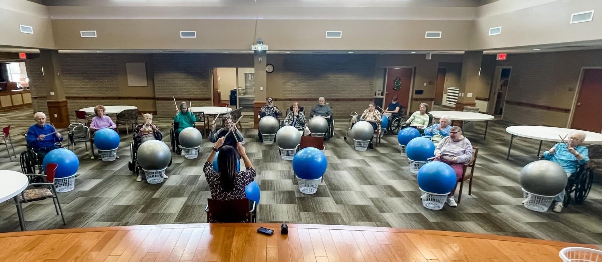 A group of seniors participating in a fitness class using exercise balls.