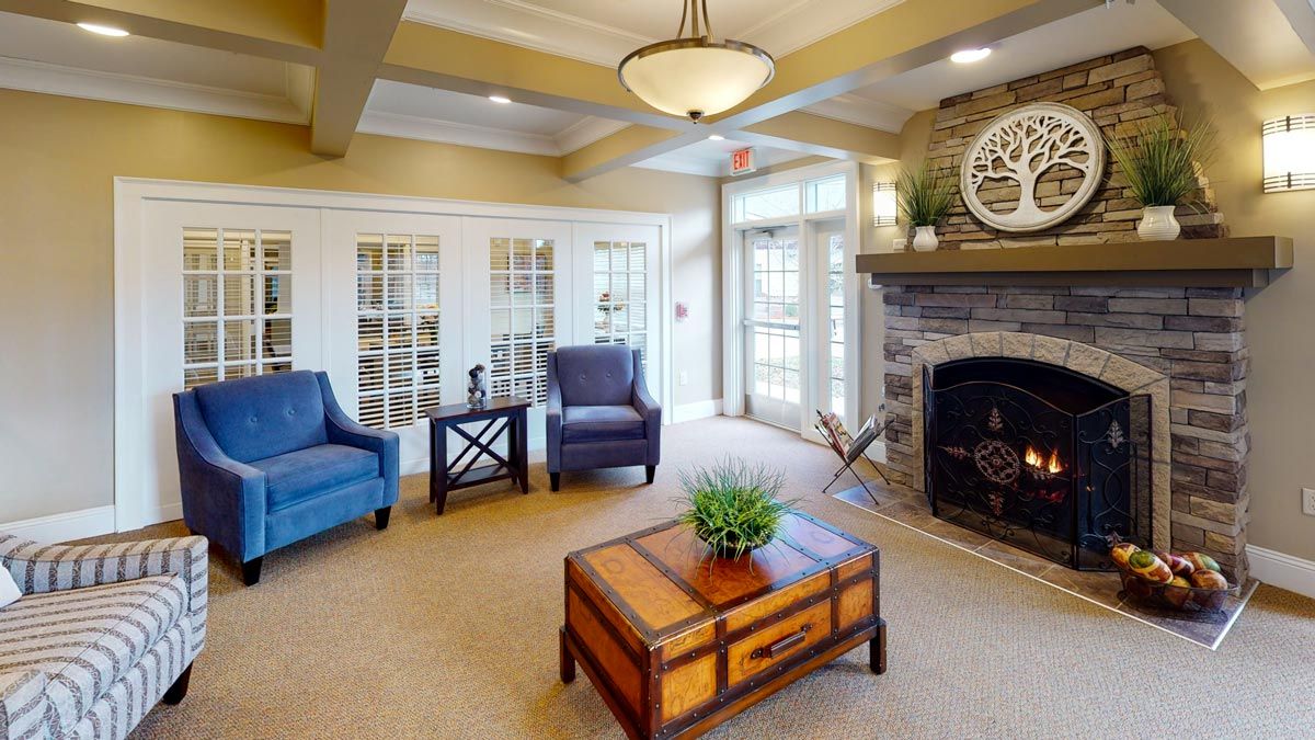 A cozy living room with comfortable seating, a fireplace, and stylish decor.