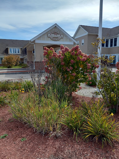 A view of a well-maintained garden in front of a modern residential building.
