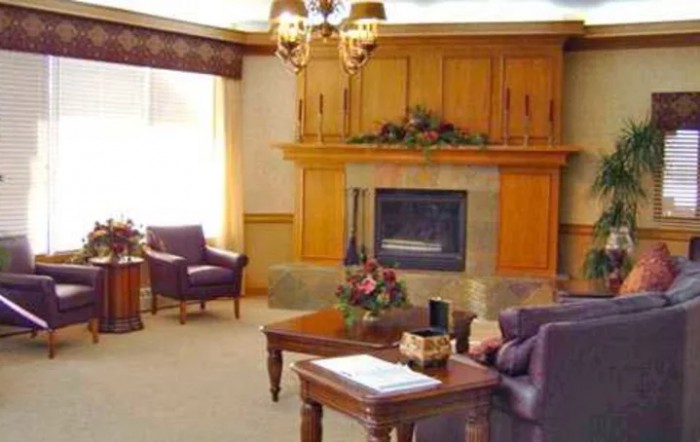 A cozy living room featuring a fireplace and traditional furniture.