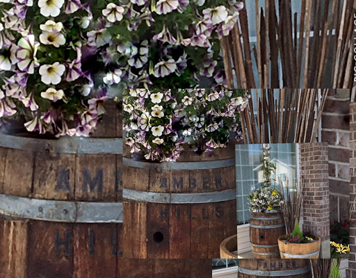 A beautiful arrangement of flowers in rustic barrels, blending nature with a charming wooden aesthetic.