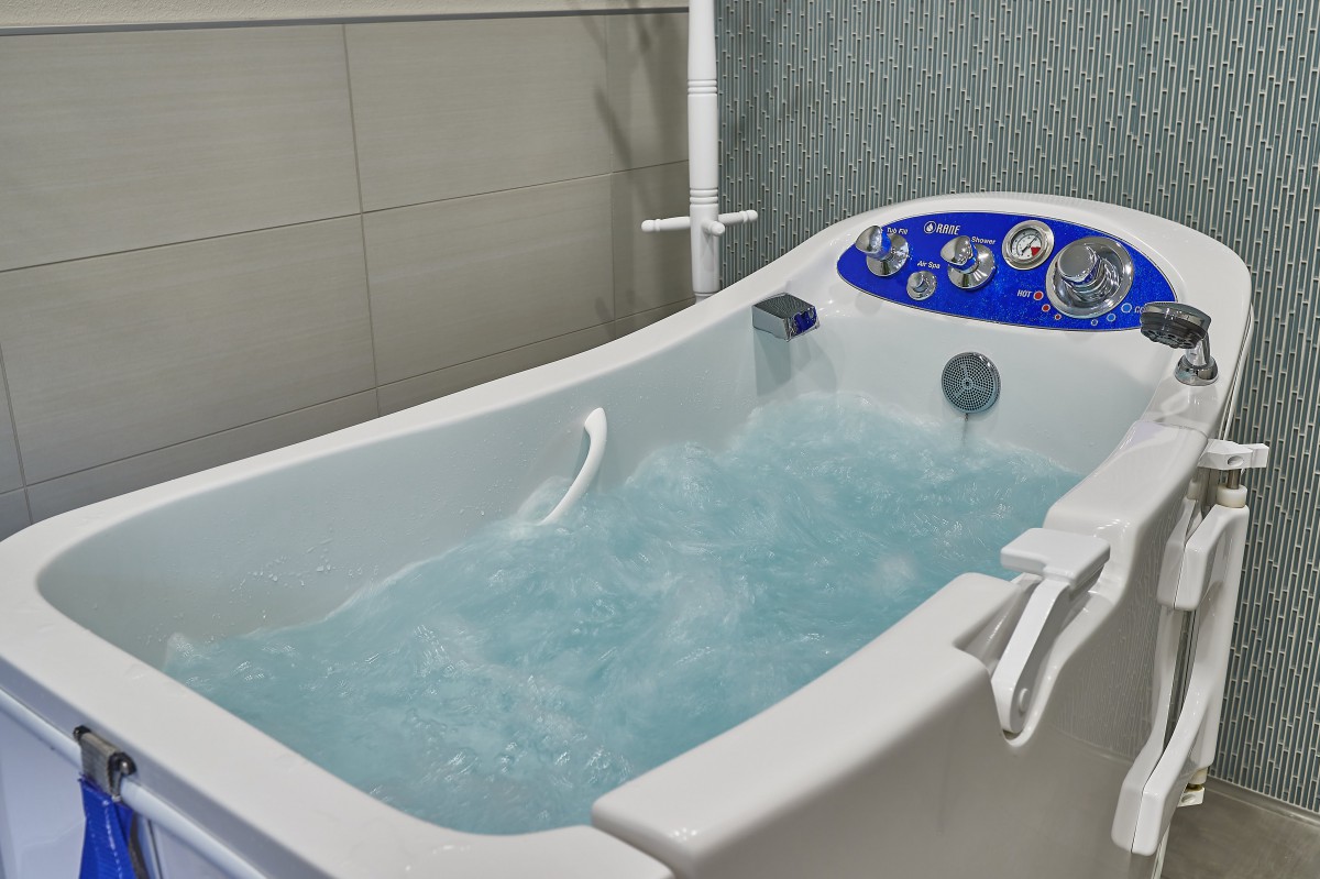 A luxurious indoor jacuzzi filled with water.