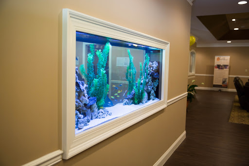 A beautifully designed wall-mounted aquarium, bringing a touch of marine life to the interior space.